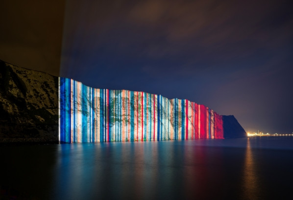 Image of University of Reading's climate stripes projected on Cliffs of Dover